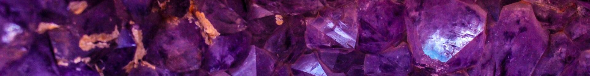 Close-up view of a beautiful amethyst crystal cluster showcasing its vibrant purple hues and natural texture.